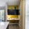 study desk and shelves next to kitchen