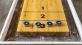 close-up of shuffleboard table and pieces