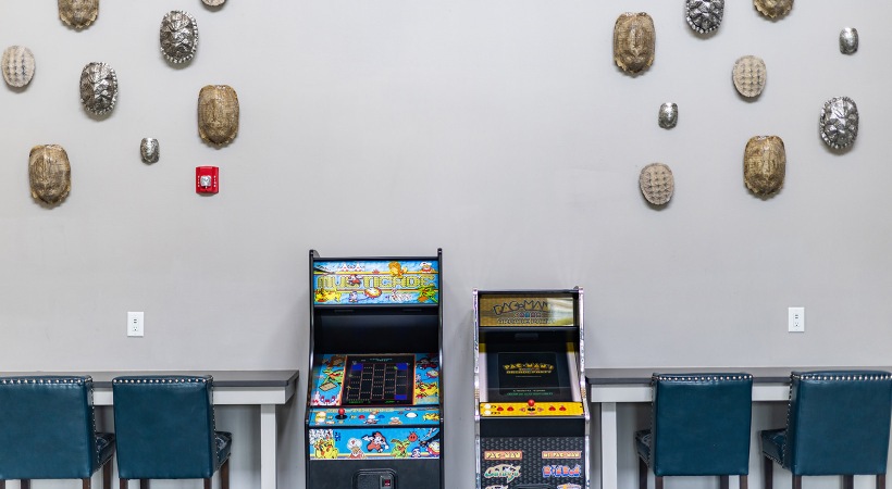 shot of arcade games against a wall